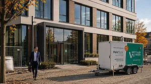 Heizmobil vor Bürogebäude